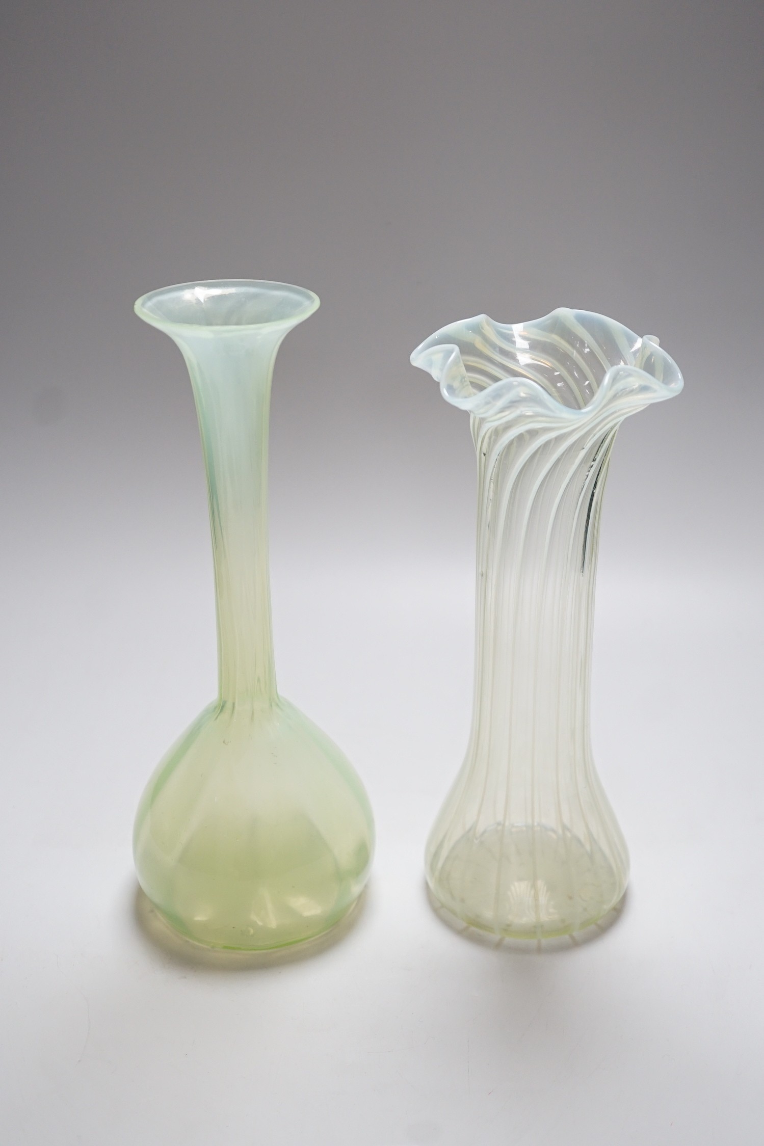 Two Victorian vaseline glass vases, tallest 27cms